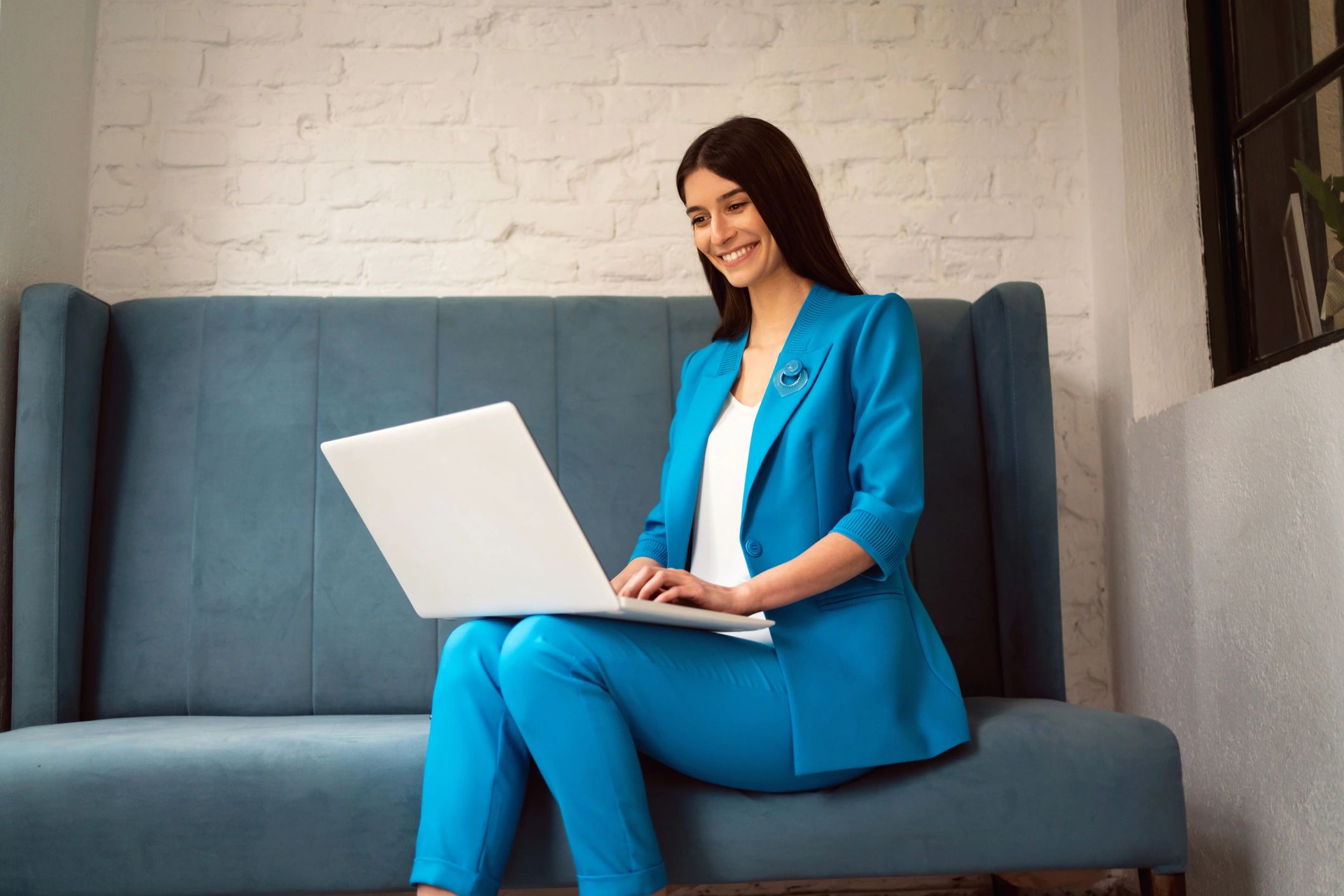 Professional headshot of a businesswoman on a laptop call