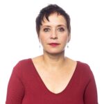 Studio portrait of a mature woman looking serious in front of white background